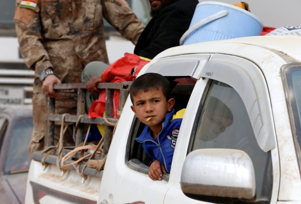 A displaced Iraqi boy is pictured after escaping from Islamic State controlled village of Abu Jarboa during clashes with IS militants near Mosul, Iraq November 1, 2016. REUTERS/Ahmed Jadallah