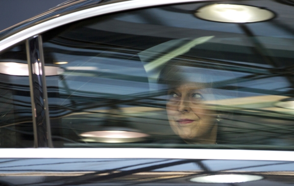 British Prime Minister Theresa May, looks out from her car window as she arrives for an EU Summit in Brussels on Thursday, Dec. 15, 2016. European Union leaders meet Thursday in Brussels to discuss defense, migration, the conflict in Syria and Britain's plans to leave the bloc. (AP Photo/Virginia Mayo)