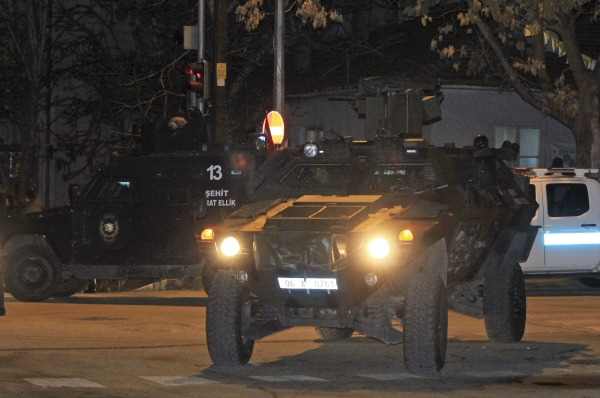 Turkish police officers in armoured vehicles secure the area close to a photo gallery where the Russian Ambassador to Turkey, Andrei Karlov, was shot by a gunman in Ankara, Turkey, Monday, Dec. 19, 2016. A Russian official says that the country's ambassador to Turkey has died after being shot by a gunman in Ankara. (IHA photo via AP)