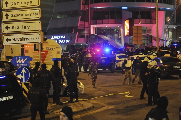 Turkish police officers cordon off the area close to a photo gallery where the Russian Ambassador to Turkey, Andrei Karlov, was shot and killed by a gunman in Ankara, Turkey, Monday, Dec. 19, 2016. (AP Photo/Osmancan Gurdogan)