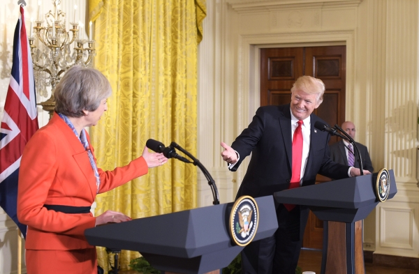 Britain's Prime Minister Teresa May gestures at a joint press conference with US President Donald Trump in the East Room of the White House on January 27, 2017 in Washington, DC. / AFP / MANDEL NGAN
