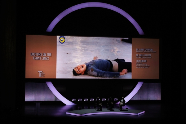 An image of a Syrian man dying from a suspected Syrian government chemical attack is shown on the screen during a panel speaking about the difficulties of doctors working in Syria during the opening night of the Women In The World Summit in New York, U.S., April 5, 2017.  REUTERS/Lucas Jackson FOR EDITORIAL USE ONLY. NO RESALES. NO ARCHIVES