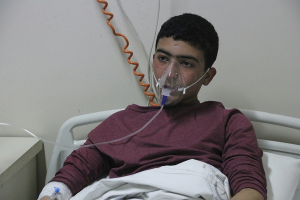 In this photo taken on late Tuesday, April 4, 2017 and made available Wednesday, April 5, a victim of alleged chemical weapons attacks in Syrian city of Idlib, at a local hospital in Reyhanli, Turkey. A suspected chemical attack in a town in Syria's rebel-held northern Idlib province killed dozens of people on Tuesday, opposition activists said, describing the attack as among the worst in the country's six-year civil war.(IHA via AP)