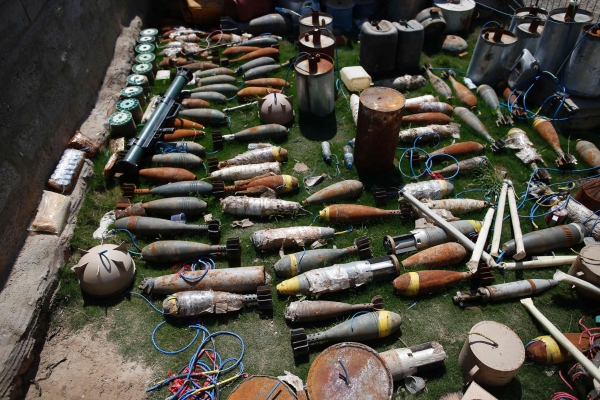 A picture shows ammunition, mortar launchers and other type of explosives 
that were confiscated from Islamic State (IS) group jihadists in western Mosul on April 6, 2017, as Iraqi forces advance in their offensive to retake the city from IS.  The fighting in west Mosul has forced up to 15,000 people to flee their homes every day recently, straining humanitarian resources and leaving many in very difficult conditions. / AFP / AHMAD GHARABLI
