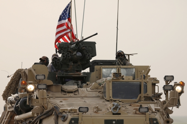 U.S forces on their military vehicle drive in the town of Darbasiya next to the Turkish border, Syria April 28, 2017. REUTERS/Rodi Said