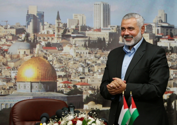 FILE PHOTO: Senior Hamas leader Ismail Haniyeh gestures before delivering a farewell speech for his former position as a Hamas government Prime Minister, in Gaza City June 2, 2014. REUTERS/Suhaib Salem/File Photo