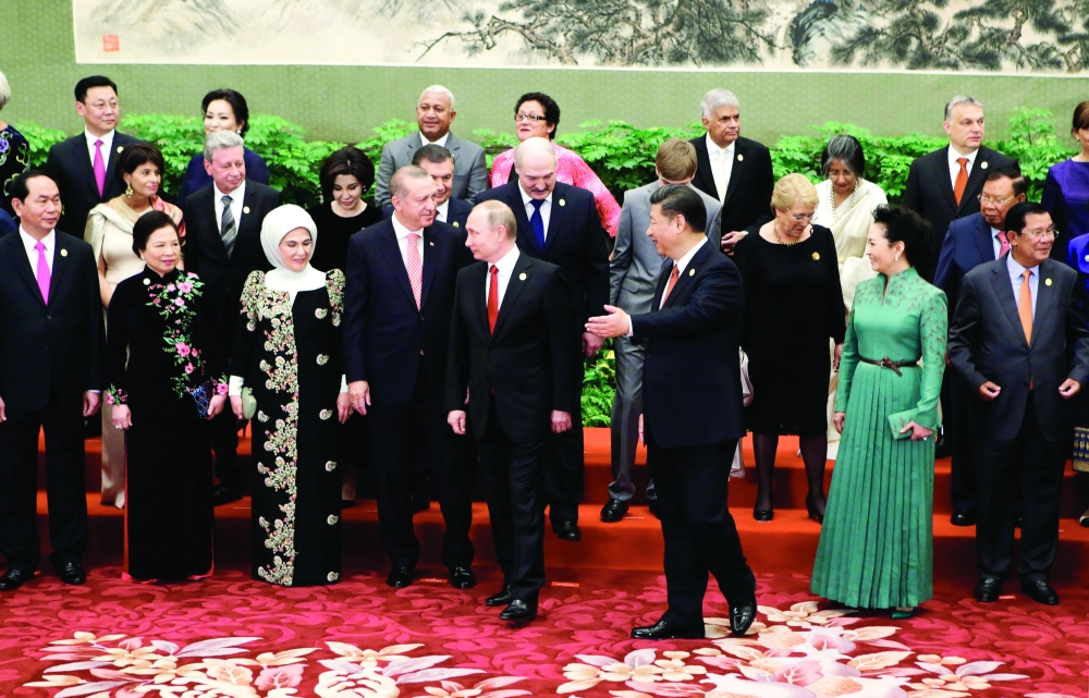 Chinese President Xi Jinping, centre right,  Russian President Vladimir Putin , centre left and other guests and delegates attend the welcoming banquet for the Belt and Road Forum, in Beijing, Sunday, May 14, 2017.  (Jason Lee/Pool Photo via AP)