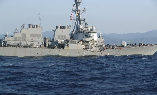 In this photo provided by Japan's 3rd Regional Coast Guard Headquarters, the USS Fitzgerald is seen off Izu Penninsula in, Japan, after the Navy destroyer collided with a merchant ship, Saturday,  June 17, 2017.  Seven Navy sailors were missing and at least two, including the captain, were injured after the U.S. destroyer collided with a merchant ship off the coast of Japan before dawn Saturday, the U.S. Navy and Japanese coast guard reported. (Japan's 3rd Regional Coast Guard Headquarters via AP)