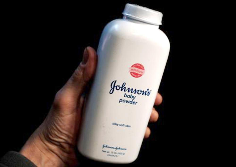 A bottle of Johnson and Johnson Baby Powder is seen in a photo illustration taken in New York, February 24, 2016. Consumers expressed concern on social media about a talc-based baby powder made by Johnson & Johnson on Wednesday after a Missouri jury ordered the company to pay $72 million in damages to the family of a woman who said her death from cancer was linked to use of the product. REUTERS/Mike Segar/Illustration