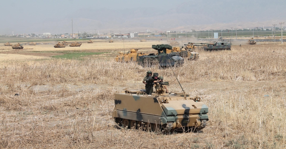 Turkish army tanks and armoured personnel carriers (APC) are seen during a military exercise near the Turkish-Iraqi border in Silopi, Turkey, September 18, 2017. Mehmet Selim Yalcin/Dogan News Agency, DHA via REUTERS ATTENTION EDITORS - THIS PICTURE WAS PROVIDED BY A THIRD PARTY. NO RESALES. NO ARCHIVE. TURKEY OUT. NO COMMERCIAL OR EDITORIAL SALES IN TURKEY.