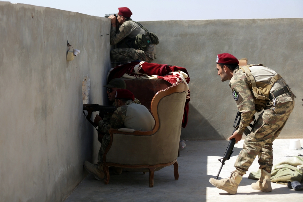 Fighters from Free Syrian Army (Al-Hamza Brigade) are seen in Hazwan town in Aleppo, Syria September 22, 2017. REUTERS/Khalil Ashawi