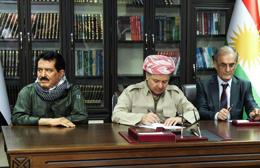 A file picture taken on September 12, 2017 shows Iraq's Kurdistan region president Massud Barzani (C) attending a meeting with Kirkuk provincial Governor Najim al-Din Karim (R), first Deputy for the Secretary General of the Patriotic Union of Kurdistan (PUK) party Kosrat Rasoul Ali (L), Peshmerga commander Jaafar Sheikh Mustafa (R), and other Peshmerga and Kurdish party leaders in the northern Iraqi city of Kirkuk.  A Baghdad court on October 19, 2017, issued an arrest warrant for the vice president of Iraqi Kurdistan on charges of 