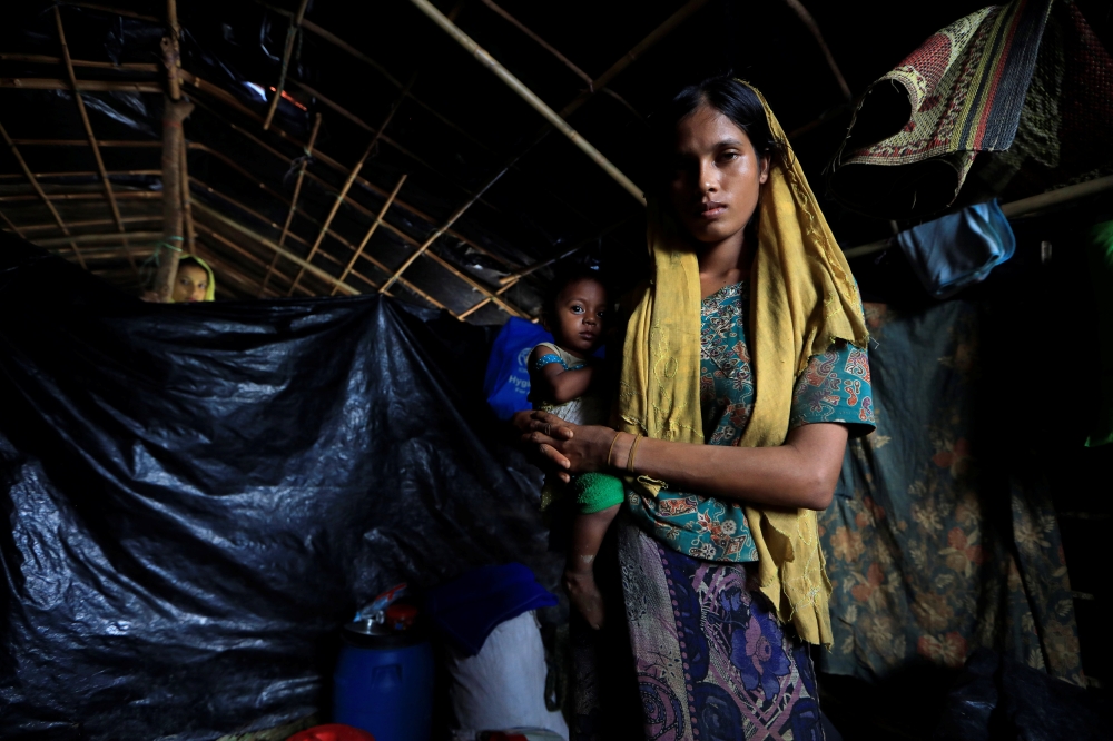 Rohingya refugees are pictured inside their shelter in Kutupalong refugees camp in Cox's Bazar, Bangladesh, October 20, 2017. REUTERS/ Zohra Bensemra