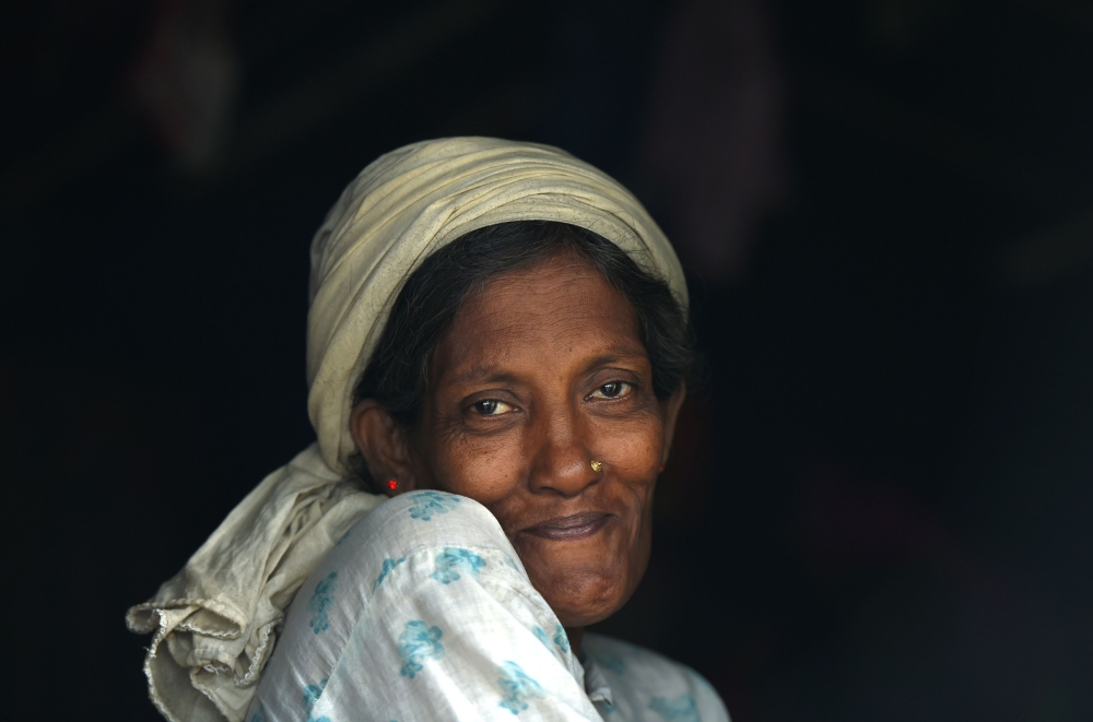 A Rohingya refugee woman looks out as she sits inside a makeshift shelter at Moynerghona refugee camp in the Bangladeshi district of Ukhia on October 29, 2017. Bangladesh is planning to introduce voluntary sterilisation in its overcrowded Rohingya camps, where nearly a million refugees are fighting for space, after efforts to encourage birth control failed. More than 600,000 Rohingya have arrived in Bangladesh since a military crackdown in neighbouring Myanmar in August triggered an exodus, straining resources in the impoverished country.
/ AFP / Tauseef MUSTAFA 