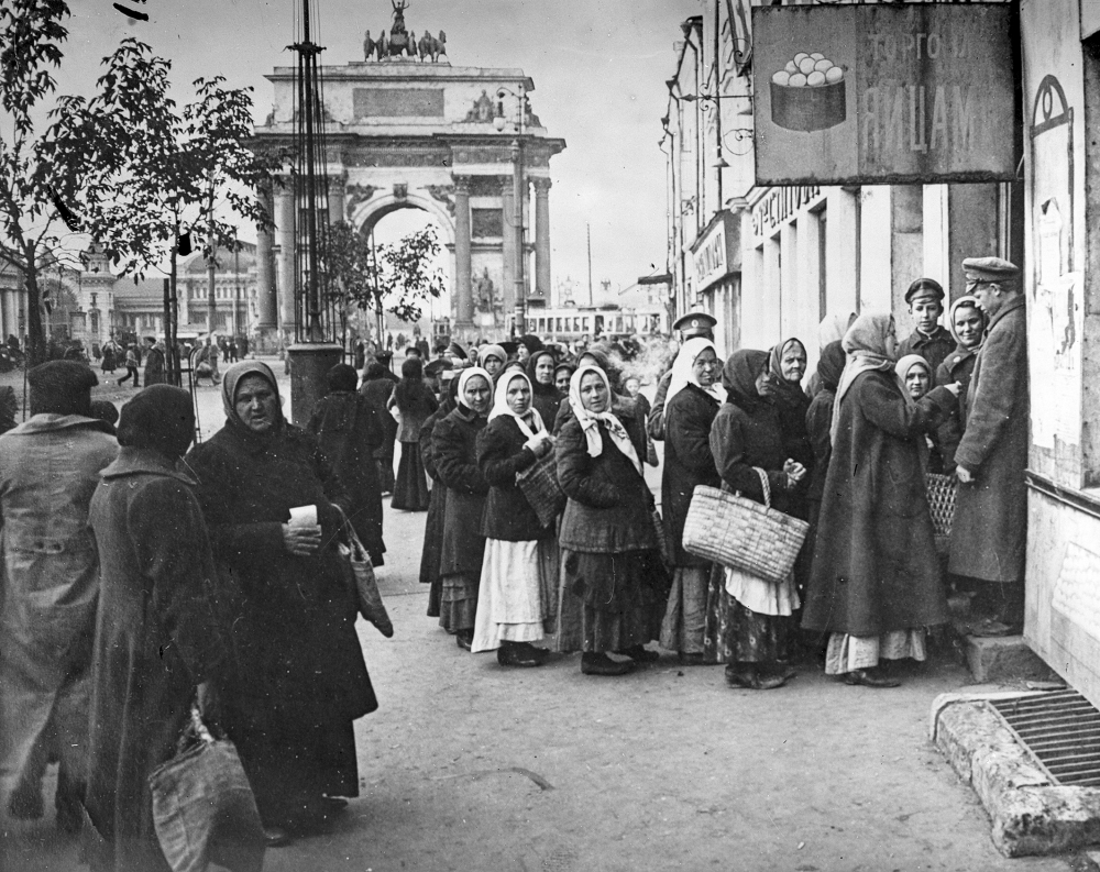 In this photo taken in Oct. 1917, provided by Russian State Documentary Film and Photo Archive, people line up to get food at Tverskaya Zastava, in Moscow, Russia. The 1917 Bolshevik Revolution was long before the digital revolution allowed anyone to instantly document events. But the clumsy cameras of the time still caught some images that capture the period's drama. (Russian State Documentary Film and Photo Archive via AP)