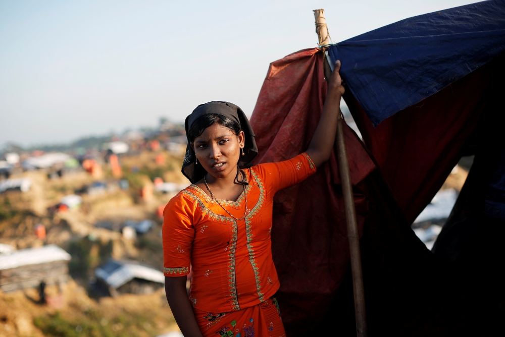 A Rohingya refugee girl stands outside her shelter at Balukhali refugee camp near Cox's Bazar, Bangladesh November 4, 2017. REUTERS/Adnan Abidi