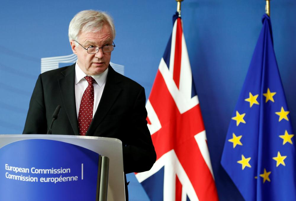 Britain's Secretary of State for Exiting the European Union David Davis talks to the media next to European Union's chief Brexit negotiator Michel Barnier (unseen) ahead of Brexit talks in Brussels, Belgium September 25, 2017. REUTERS/Francois Lenoir