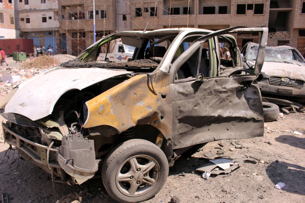 Damaged cars are seen near the site of a suicide car bomb attack outside a police forces camp in Aden, Yemen, November 14, 2017. REUTERS/Fawaz Salman