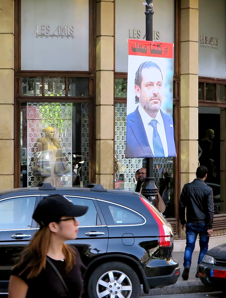 A poster showing Lebanese Prime Minister Saad al-Hariri, who announced his resignation from Saudi Arabia, is seen in Beirut, Lebanon, November 15, 2017. Words on poster reads 