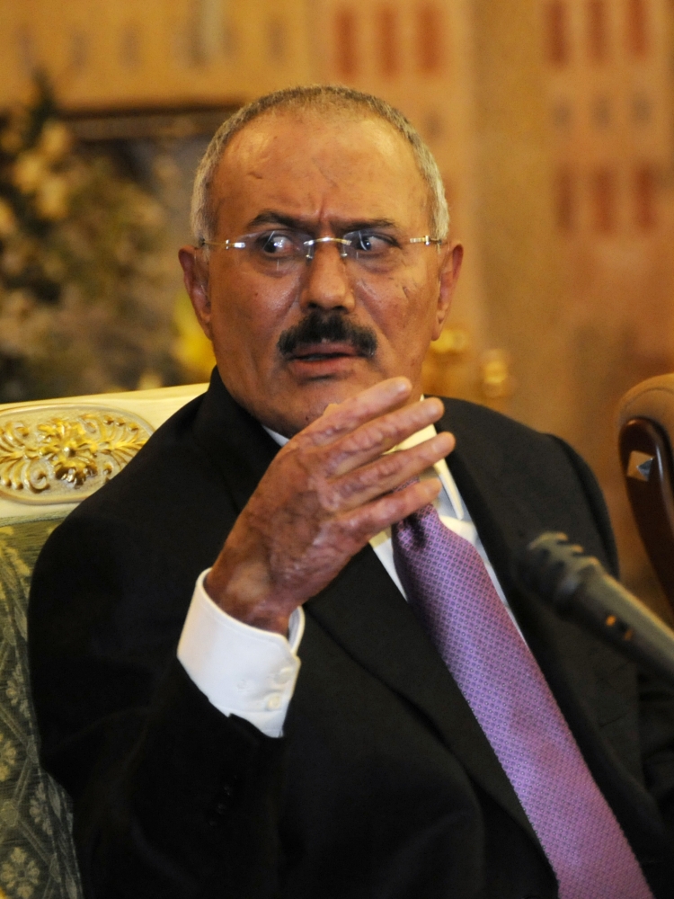 FILE - In this Dec. 24, 2011 file photo, Yemen's President Ali Abdullah Saleh gestures with a hand burned in a bombing, as he speaks during a news conference at the Presidential Palace in Sanaa, Yemen. Saleh was killed Monday, Dec. 4, 2017, by Shiite rebels with whom he had once been allied. It was a grisly end for a leader who ruled for more than 30 years by shifting alliances and playing multiple sides in the many conflicts that plagued his impoverished nation. Even after his ouster in 2012, he remained a power player driving the civil war that has brought Yemen to ruinous collapse. (AP Photo/Mohammed Hamoud, File)