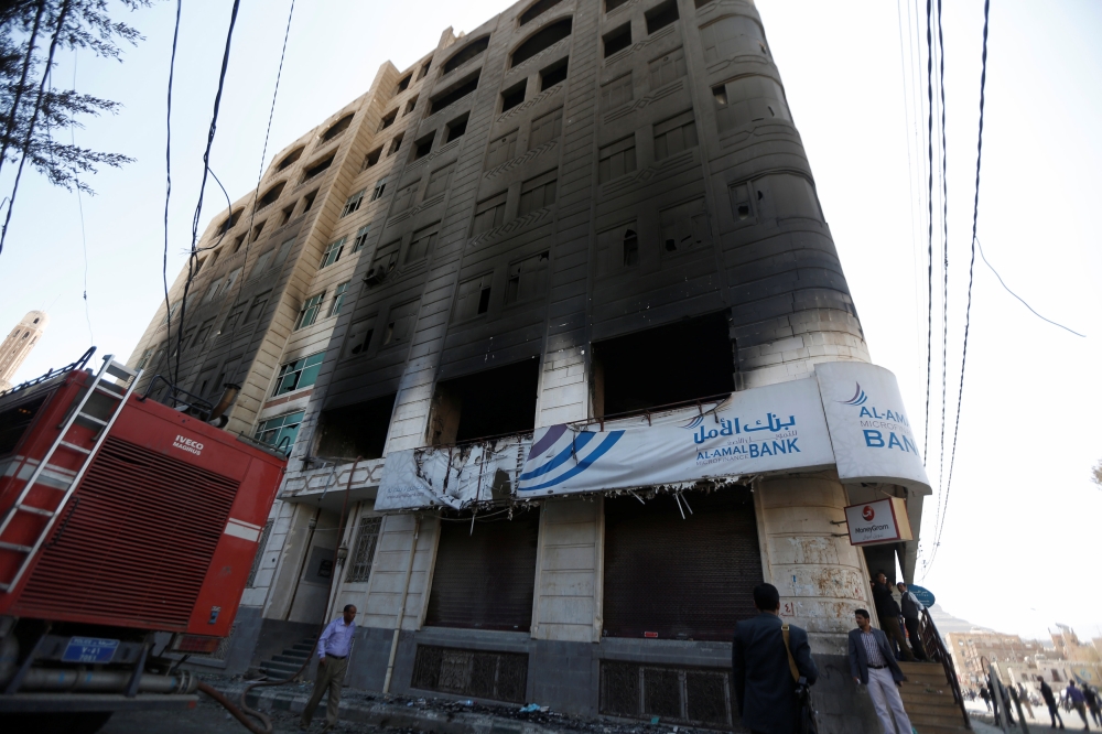 A exterior view of a bank building shows damage from recent clashes between Houthi fighters and forces loyal to Yemen's former president Ali Abdullah Saleh in Sanaa, Yemen December 5, 2017. REUTERS/Khaled Abdullah