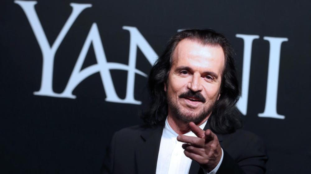 Greek musician Yanni poses for a photo before a press conference at Sheikh Jaber Al-Ahmad Cultural Center in Kuwait City on April 19, 2017. 
Yanni is set to perform two shows this weekend for the first time in the Gulf state as part of his international tour. / AFP PHOTO / Yasser Al-Zayyat