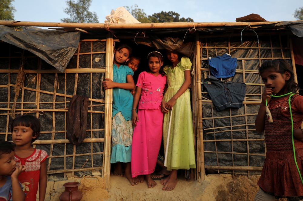 Rohingya children refugees stand in front of their temporary shelters at the Kutupalong refugee camp near Cox's Bazar, Bangladesh December 19, 2017. REUTERS/Marko Djurica