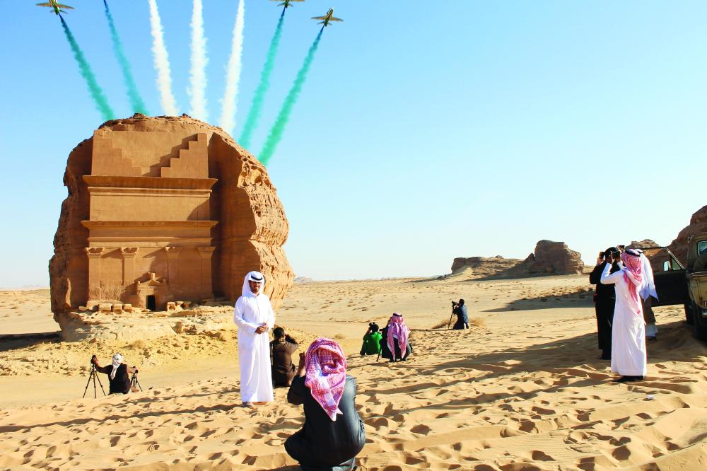 Saudi visitors watch an aerial flying display over Mada'in Saleh, a UNESCO World Heritage Site, in Mada'in Saleh, Saudi Arabia, onan. 31, 2017. MUST CREDIT: Bloomberg photo by Vivian Nereim.