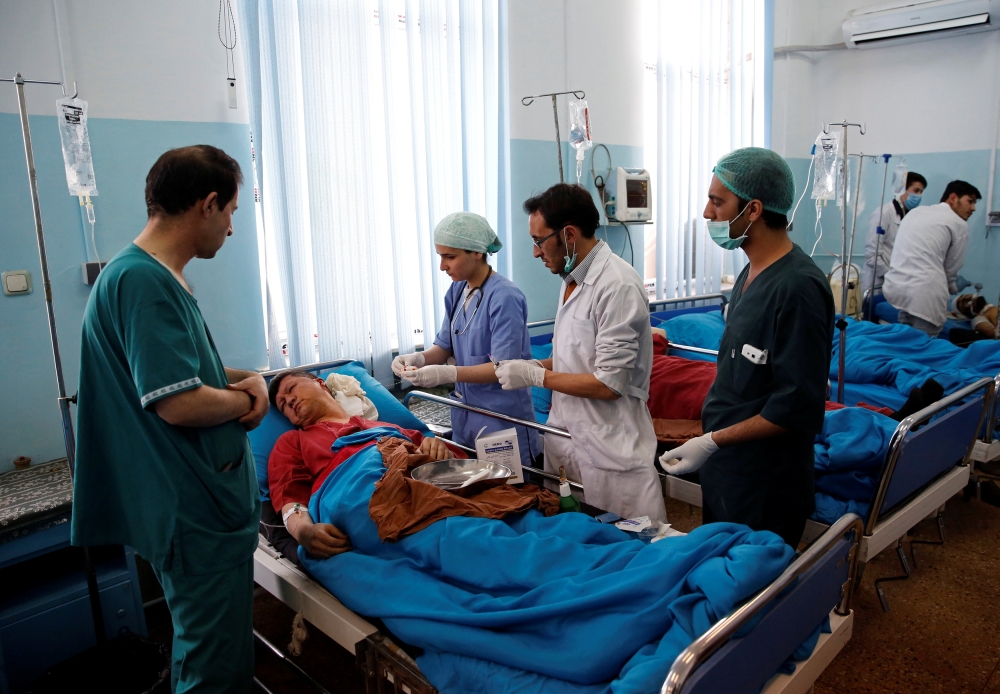 An injured man receives treatment at a hospital after a blast in Kabul, Afghanistan January 27, 2018. REUTERS/Mohammad Ismail