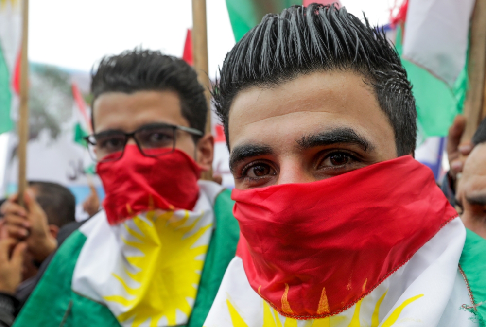 Lebanese Kurds take part in a protest near the European Commission offices in Beirut on January 28, 2018, against the ongoing Turkish military campaign in the Kurdish-held Syrian enclave of Afrin. Turkey launched an offensive against the Kurdish People's Protection Units (YPG) on January 20 in their enclave of Afrin, supporting Syrian rebels with air strikes and ground troops. / AFP / ANWAR AMRO
