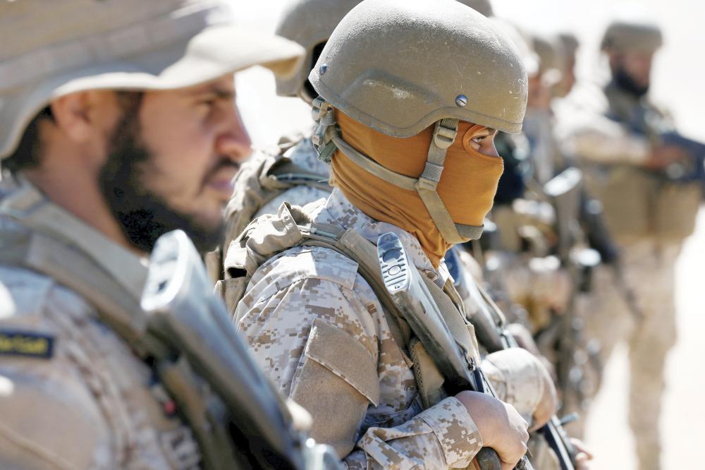 Saudi soldiers stand guard at an airfield where Saudi military cargo planes land to deliver aid in Marib, Yemen January 26, 2018. Picture taken January 26, 2018. REUTERS/Faisal Al Nasser