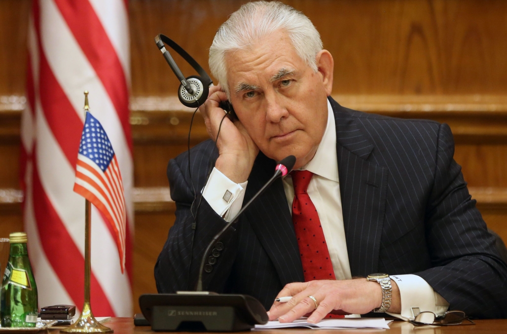 US Foreign Secretary Rex Tillerson listens with a headphone during a joint press conference with Jordanian foreign minister in Amman on February 14, 2018. Tillerson is on a regional tour of the Middle East which has already taken him to Egypt and Kuwait, where he attended the previous day a ministerial meeting of the US-led military coalition that has been fighting Islamic State group jihadists in Iraq and Syria. / AFP / afp / Khalil MAZRAAWI
