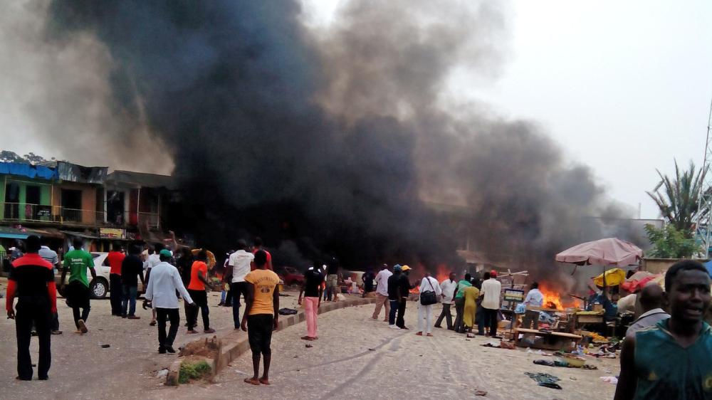 Smoke rises after a bomb blast at a bus terminal in Jos, Nigeria, on Tuesday.