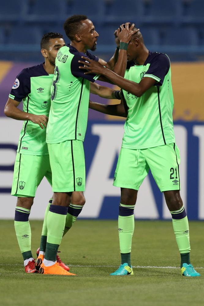 Soccer - AFC Champions League - Qatar's Al Gharafa vs Saudi Arabia's Al Ahli - Doha, Qatar - March 5, 2018 Players of Saudi Arabia's Al Ahli celebrate their goal REUTERS/Ibraheem Al Omari