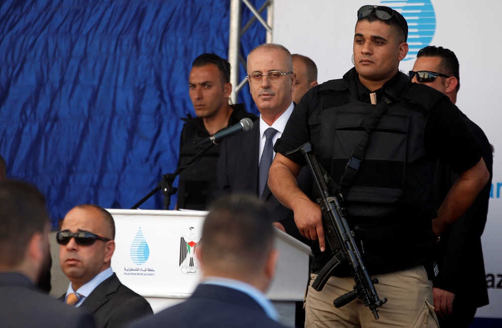 Palestinian Prime Minister Rami Hamdallah attends the inauguration ceremony of a waste treatment plant after an explosion targeted his convoy, in the northern Gaza Strip March 13, 2018. REUTERS/Mohammed Salem