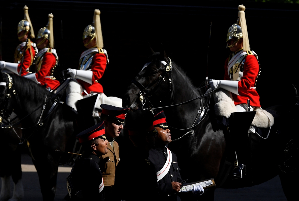 Members of the Household Cavalry, which will provide ceremonial support to the forthcoming wedding of Britain's Prince Harry and his fiancee Meghan Markle, are inspected in the Regimental Square at the Hyde Park Barracks in London, Britain, May 9, 2018. REUTERS/Toby Melville