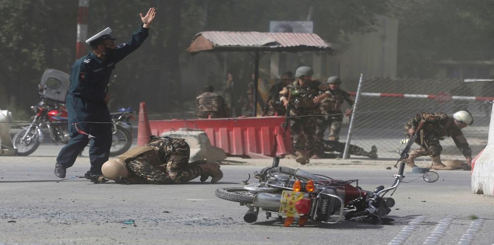 REFILE - QUALITY REPEAT Afghan security forces are seen at the site of a second blast in Kabul, Afghanistan April 30, 2018. REUTERS/Omar Sobhani