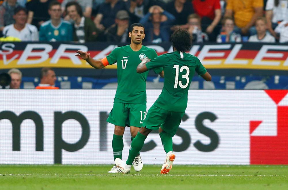 Soccer Football - International Friendly - Germany vs Saudi Arabia - BayArena, Leverkusen, Germany - June 8, 2018   Saudi Arabia's Taiseer Al Jassam celebrates scoring their first goal with Yasser Al-Shahrani    REUTERS/Thilo Schmuelgen