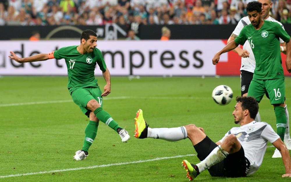 epaselect epa06794882 Saudi Arabia's Taiseer Aljassam (L) scoring his team first goal during the international friendly soccer match between Germany and Saudi Arabia in Leverkusen, Germany, 08 June 2018.  EPA/SASCHA STEINBACH