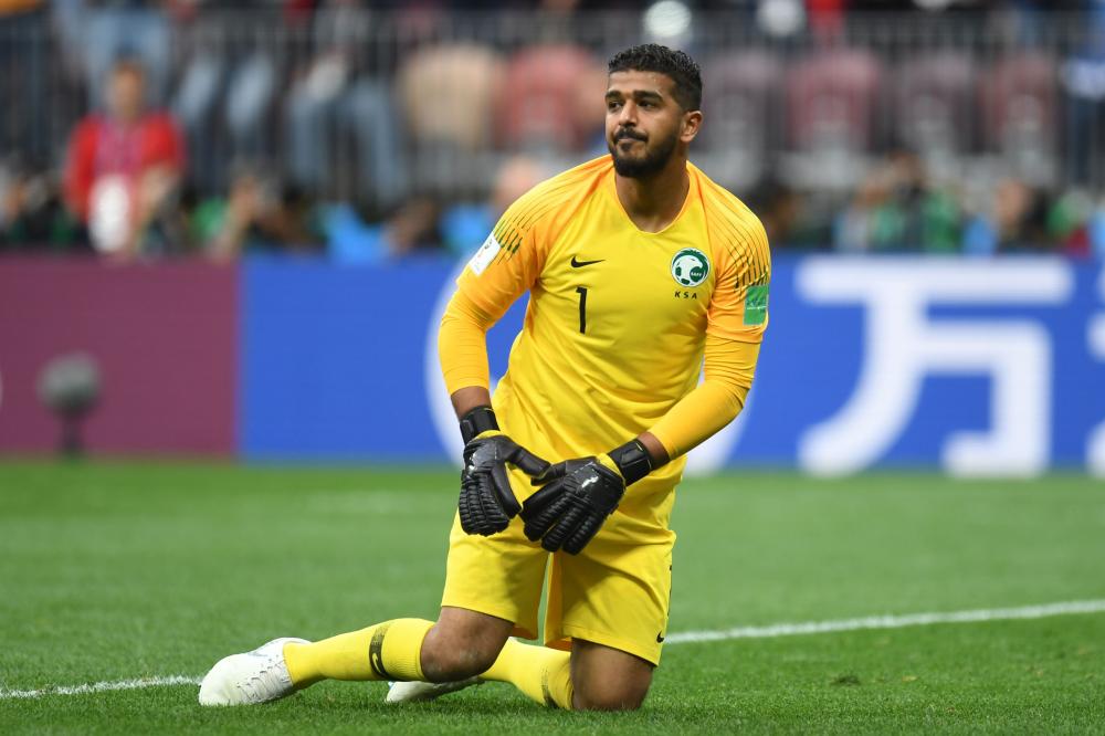 Saudi Arabia's goalkeeper Abdullah Al-Mayouf kneels on the field during the Russia 2018 World Cup Group A football match between Russia and Saudi Arabia at the Luzhniki Stadium in Moscow on June 14, 2018. RESTRICTED TO EDITORIAL USE - NO MOBILE PUSH ALERTS/DOWNLOADS
 / AFP / Patrik STOLLARZ / RESTRICTED TO EDITORIAL USE - NO MOBILE PUSH ALERTS/DOWNLOADS
