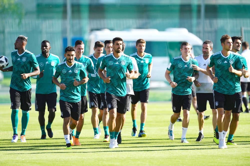 Germany's players warm up during a training session in Vatutinki, near Moscow, on June 15, 2018, as part of the Russia 2018 World Cup football tournament. 
 - 
 / AFP / Patrik STOLLARZ
