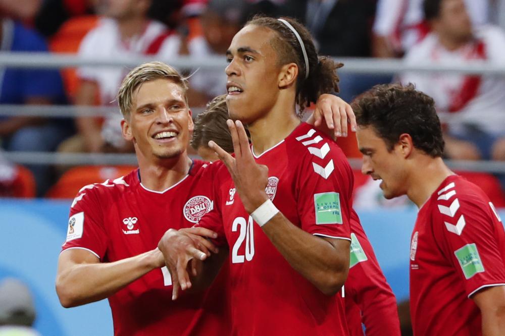 Denmark's forward Yussuf Poulsen (C) celebrates with teammates after scoring a goal during the Russia 2018 World Cup Group C football match between Peru and Denmark at the Mordovia Arena in Saransk on June 16, 2018.  RESTRICTED TO EDITORIAL USE - NO MOBILE PUSH ALERTS/DOWNLOADS
 / AFP / Jack GUEZ / RESTRICTED TO EDITORIAL USE - NO MOBILE PUSH ALERTS/DOWNLOADS
