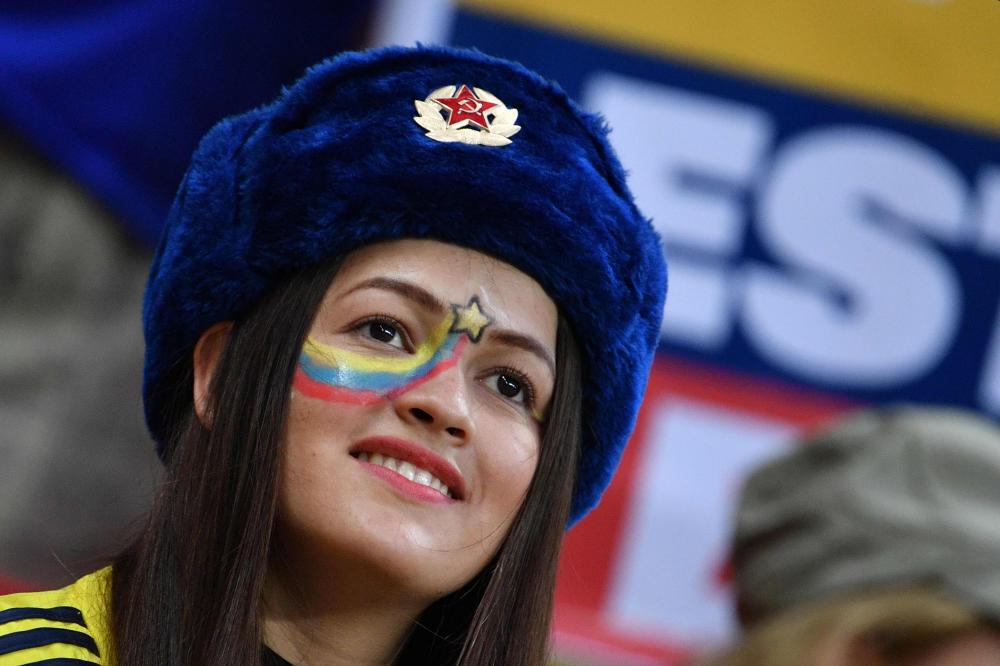 A Colombia's fan looks on before the Russia 2018 World Cup Group H football match between Poland and Colombia at the Kazan Arena in Kazan on June 24, 2018. RESTRICTED TO EDITORIAL USE - NO MOBILE PUSH ALERTS/DOWNLOADS
 / AFP / SAEED KHAN / RESTRICTED TO EDITORIAL USE - NO MOBILE PUSH ALERTS/DOWNLOADS
