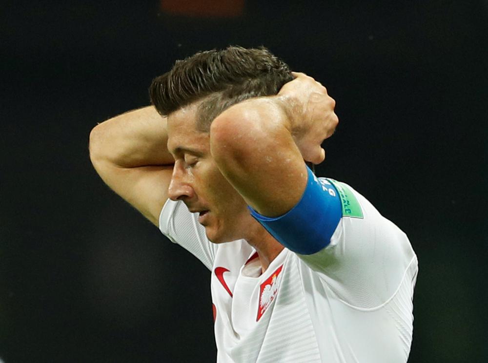 Soccer Football - World Cup - Group H - Poland vs Colombia - Kazan Arena, Kazan, Russia - June 24, 2018 Poland's Robert Lewandowski looks dejected REUTERS/John Sibley