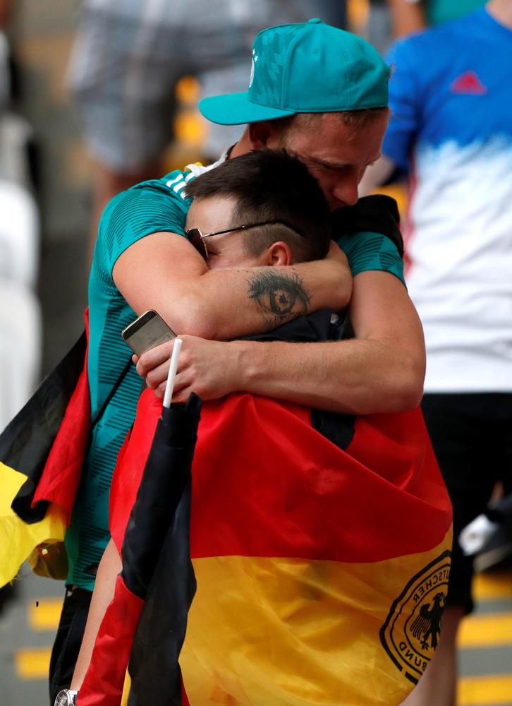 Soccer Football - World Cup - Group F - South Korea vs Germany - Kazan Arena, Kazan, Russia - June 27, 2018   Germany fans look dejected after the match as they go out of the World Cup   REUTERS/John Sibley