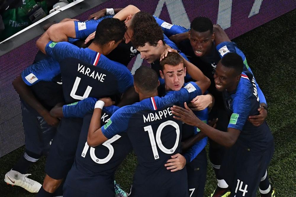 France's defender Samuel Umtiti celebrates with teammates after scoring a goal during the Russia 2018 World Cup semi-final football match between France and Belgium at the Saint Petersburg Stadium in Saint Petersburg on July 10, 2018. RESTRICTED TO EDITORIAL USE - NO MOBILE PUSH ALERTS/DOWNLOADS

 / AFP / Jewel SAMAD / RESTRICTED TO EDITORIAL USE - NO MOBILE PUSH ALERTS/DOWNLOADS

