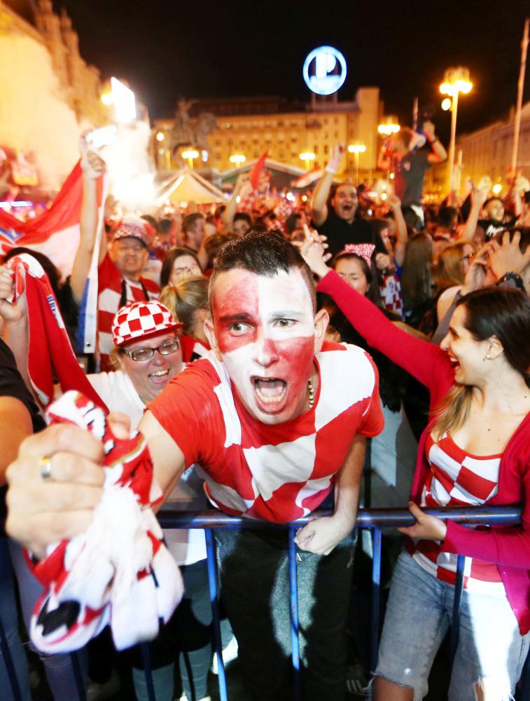 Soccer Football - World Cup - Semi-Final - Croatia v England - Zagreb, Croatia - July 11, 2018. Croatia's fans watch the broadcast of the World Cup semi-final match between Croatia and England in the fan zone. REUTERS/Antonio Bronic