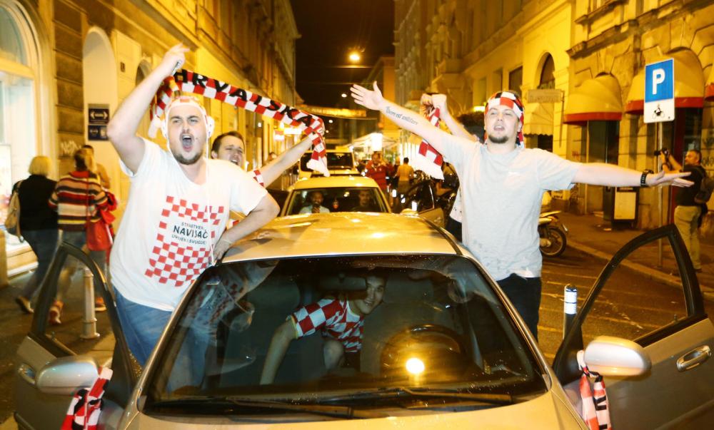 Soccer Football - World Cup - Semi-Final - Croatia v England - Zagreb, Croatia - July 11, 2018. Croatia's fans celebrate after Croatia beat England in semi-final. REUTERS/Antonio Bronic