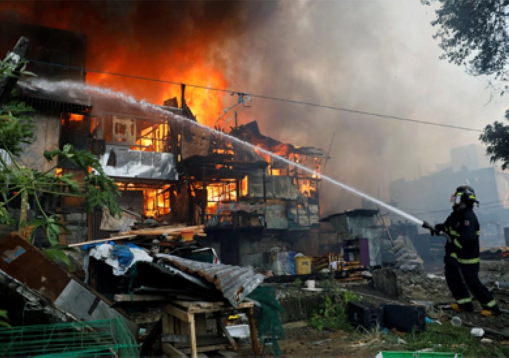 A fire has left at least 25,000 people homeless in a town on a southern Philippine Island. 