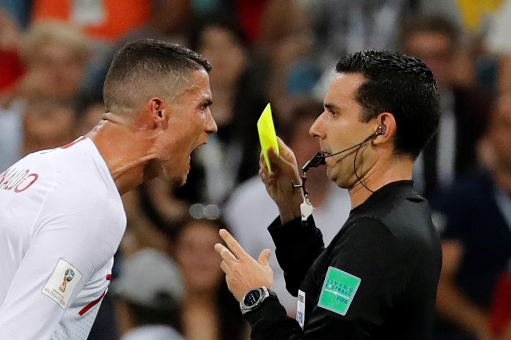 Soccer Football - World Cup - Round of 16 - Uruguay vs Portugal - Fisht Stadium, Sochi, Russia - June 30, 2018   Portugal's Cristiano Ronaldo reacts at referee Cesar Arturo Ramos   REUTERS/Toru Hanai